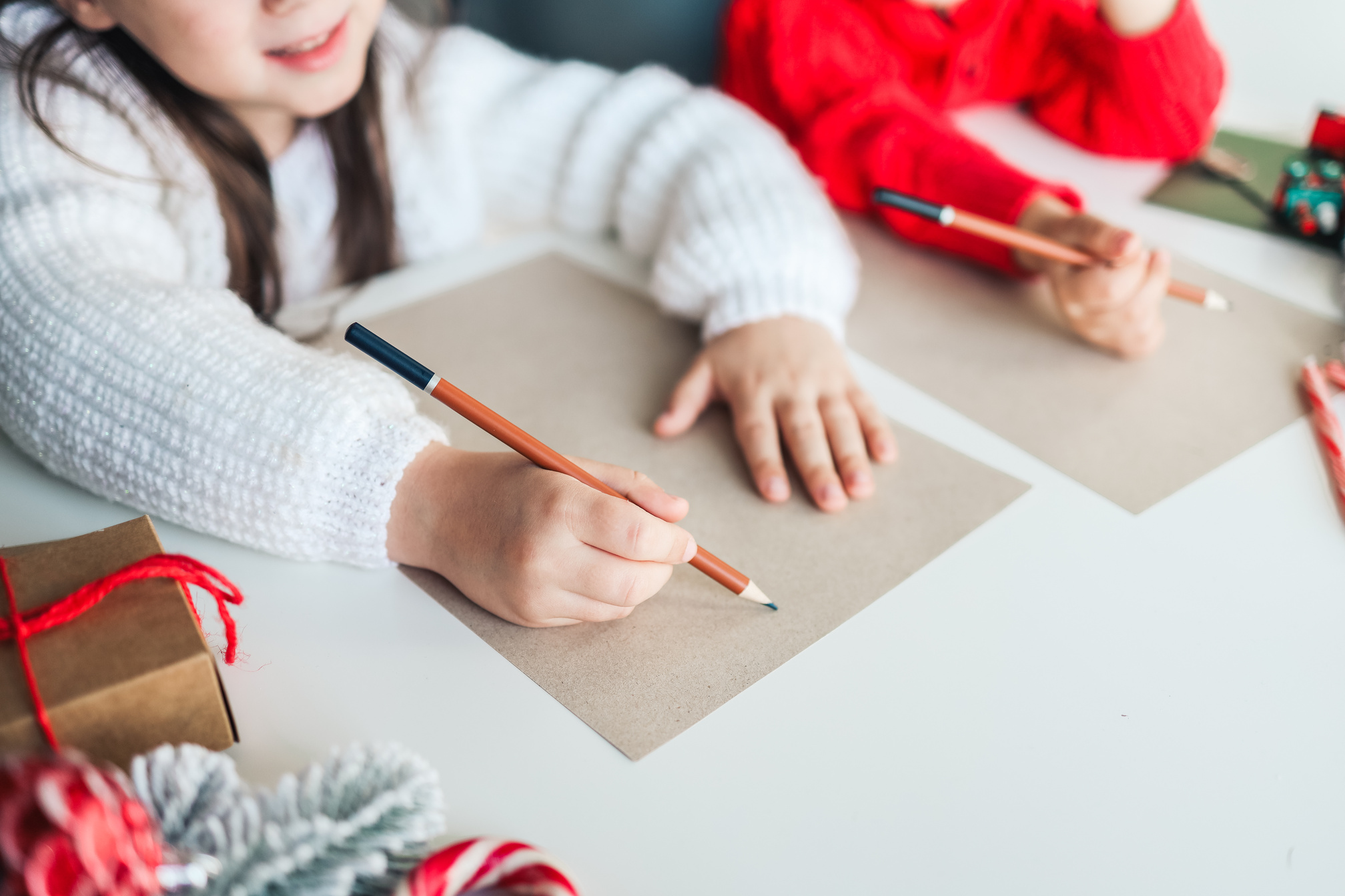 Children write a letter to Santa, festive atmospheric photo